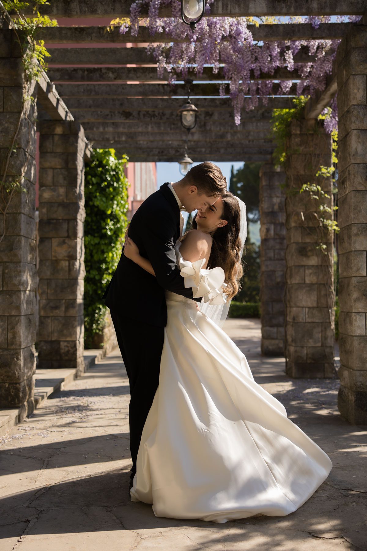 Elegant bride and groom at Villa Tartini wedding venue with sea views in Slovenia.