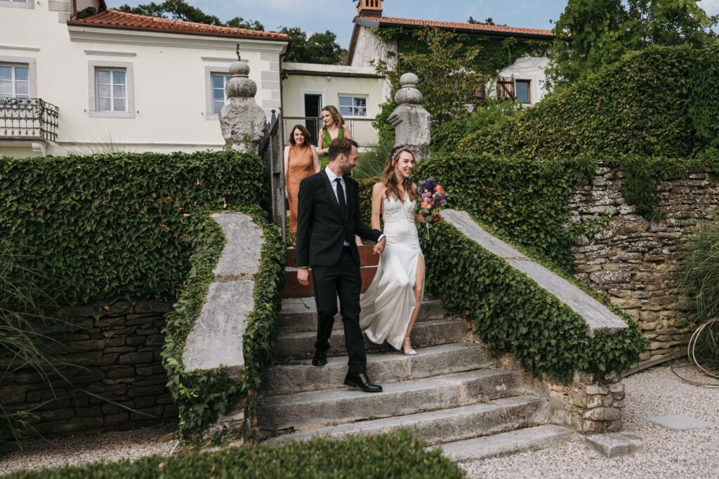 villa bonomo wedding trieste bride and groom walking stairs italian villa garden