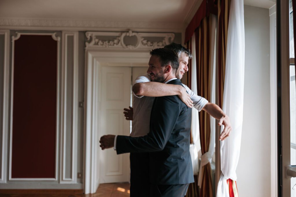 groom hug emotional moment villa bonomo wedding trieste italy getting ready