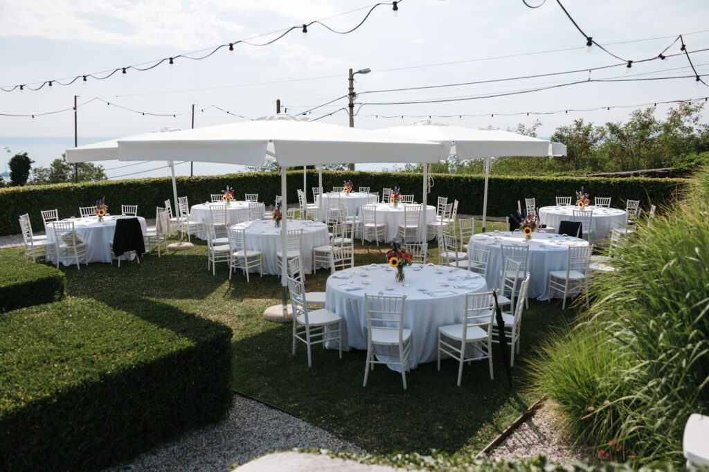 villa bonomo wedding reception setup trieste italy outdoor tables garden