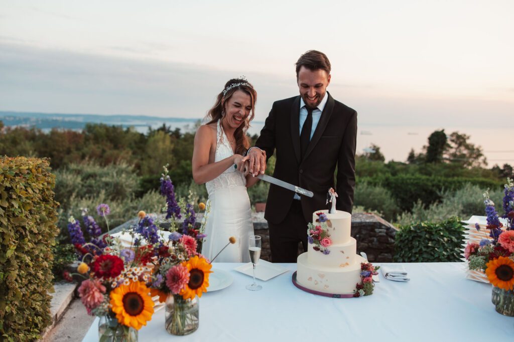 villa bonomo wedding cake cutting trieste italy bride and groom sunset