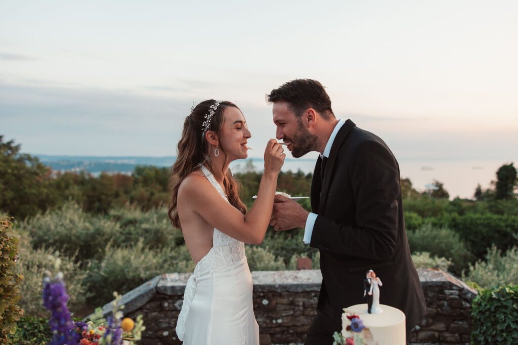 villa bonomo wedding cake moment trieste italy bride feeding groom romantic