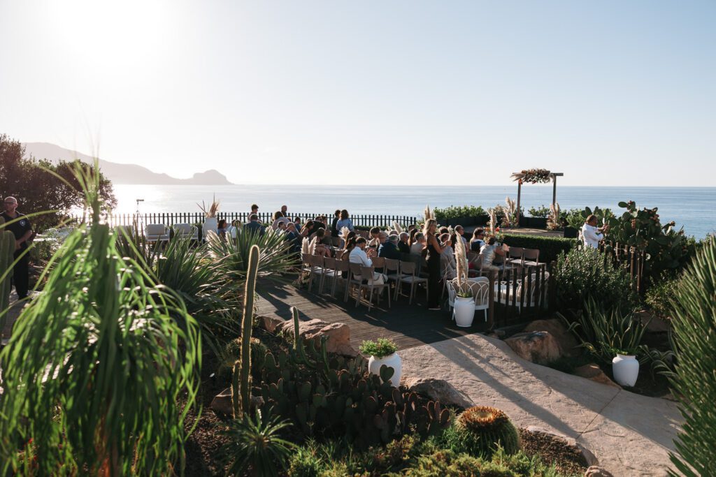destination wedding dinner in Cefalù Sicily with ocean view and golden light