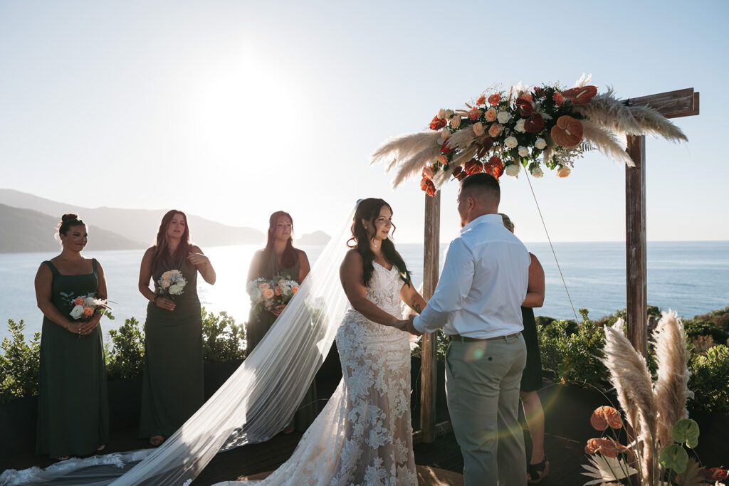 seaside wedding ceremony in Cefalù Sicily with ocean view and floral arch