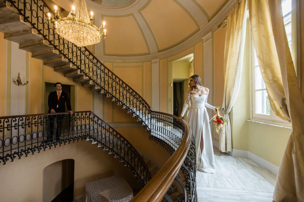 Villa Galieta at Lake Como beautiful oval steps with bride and groom posing for a photoshoot
