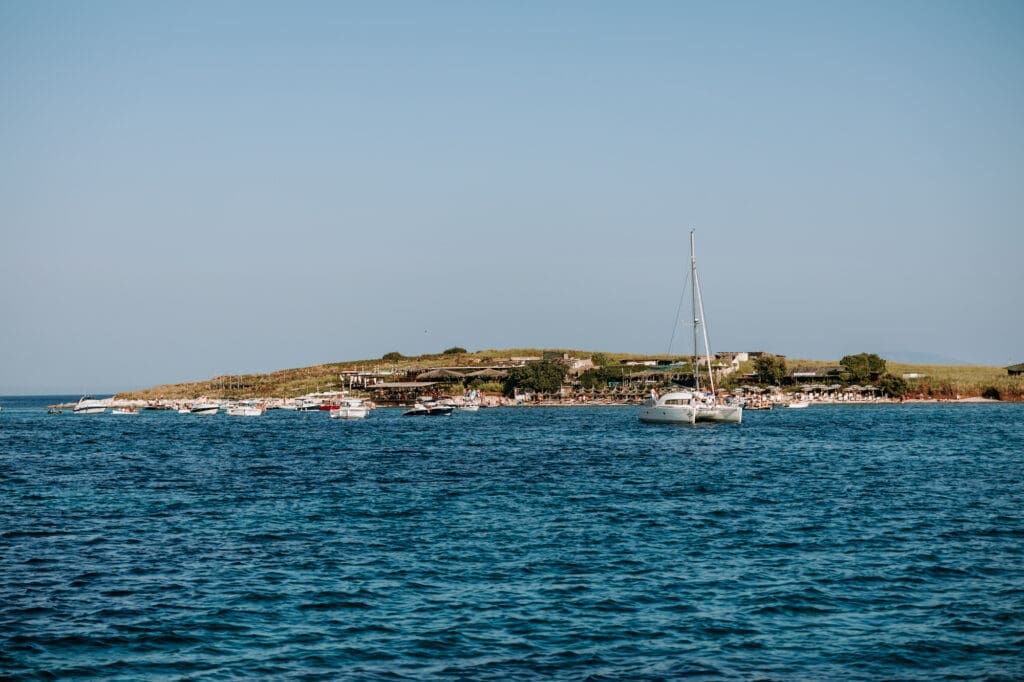 View of Levan Island in Croatia with sailboats and calm Adriatic Sea during a summer destination wedding weekend.