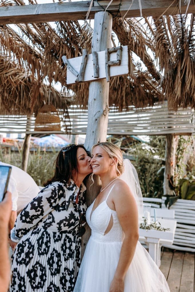Bride sharing a sweet moment with her mother after an intimate beach wedding ceremony on Levan Island in Croatia.