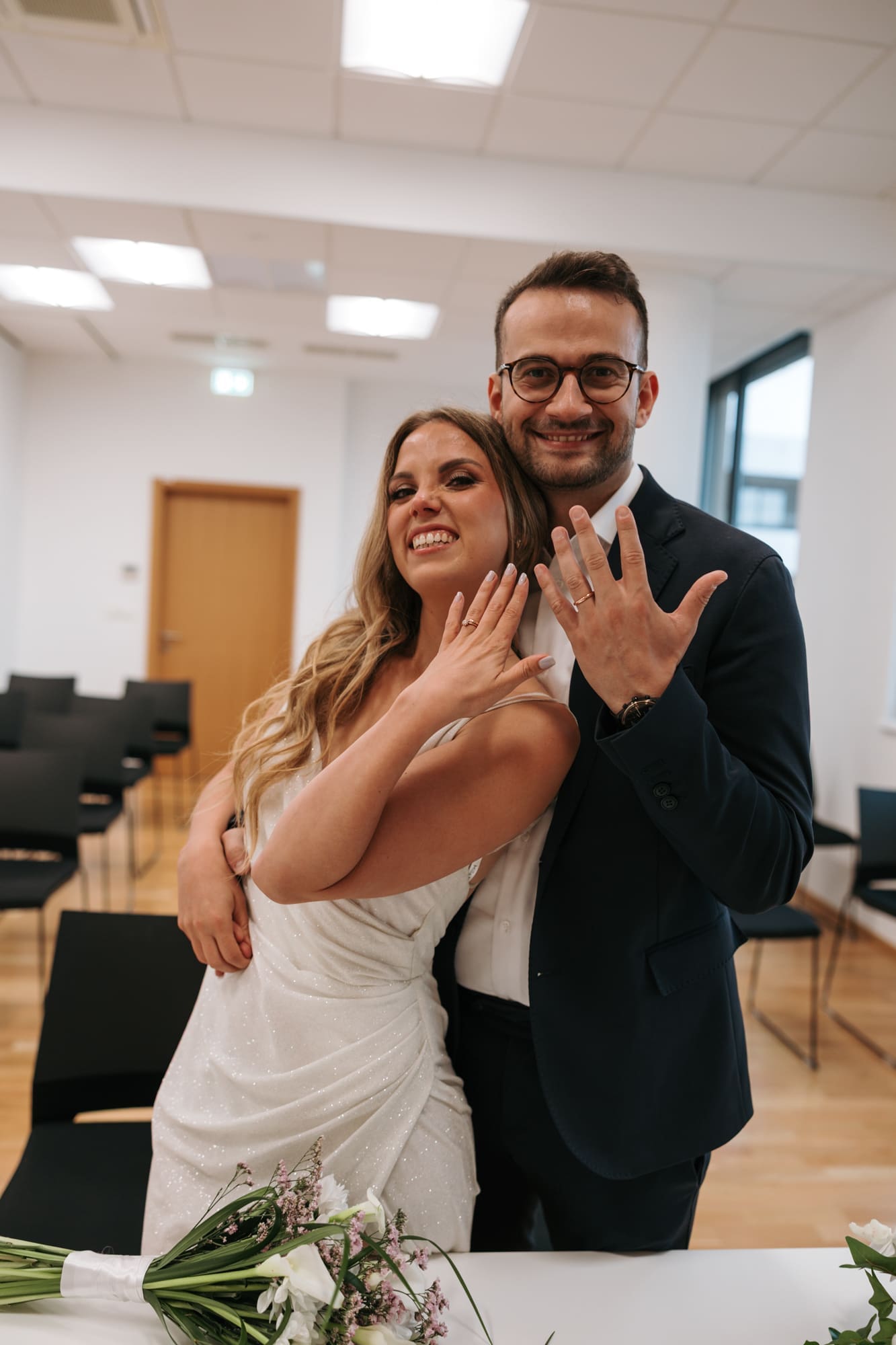 Newlyweds showing their wedding rings after their civil wedding ceremony at the registry office in Koper, Slovenia.