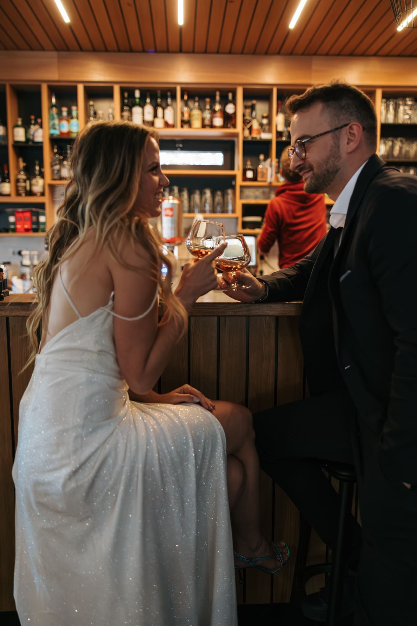 Bride and groom sharing a celebratory drink in Sežana, Slovenia, after their civil wedding ceremony.