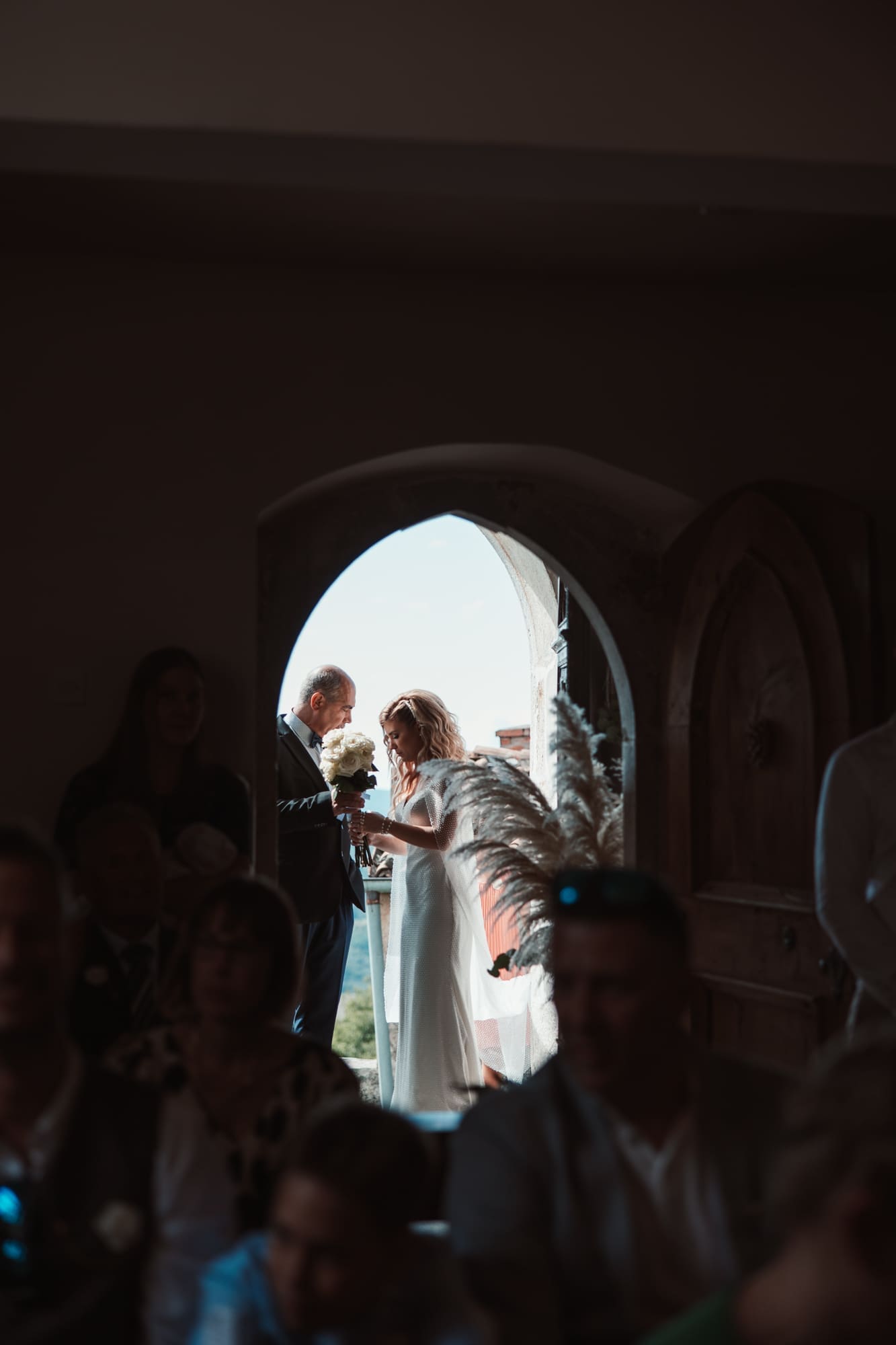 Zala entering the Church of St. Michael in Šmihelj before the wedding ceremony in Slovenia.