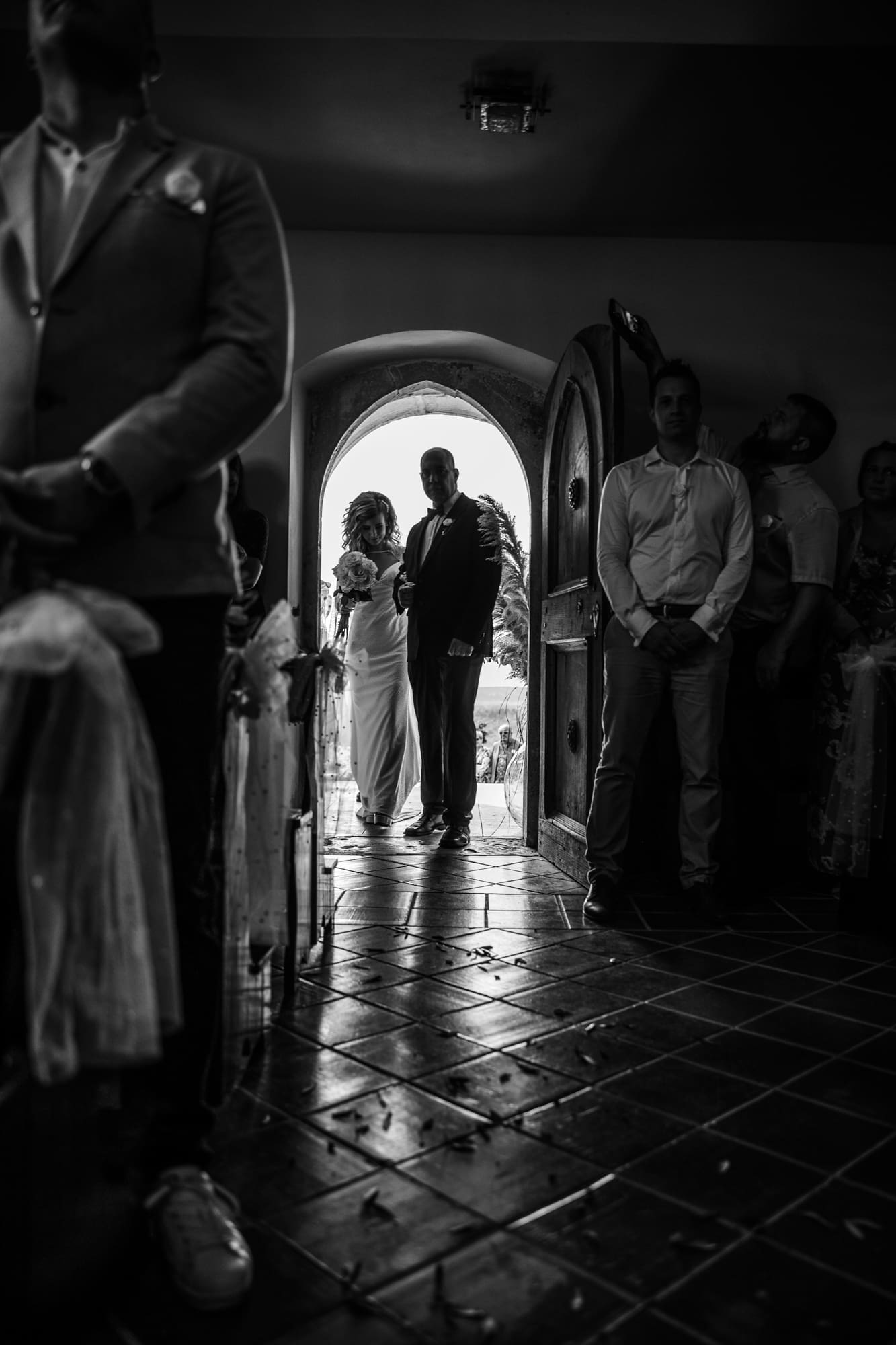 Zala arriving with her father at the entrance of the Church of St. Michael before the wedding ceremony in Šmihelj.