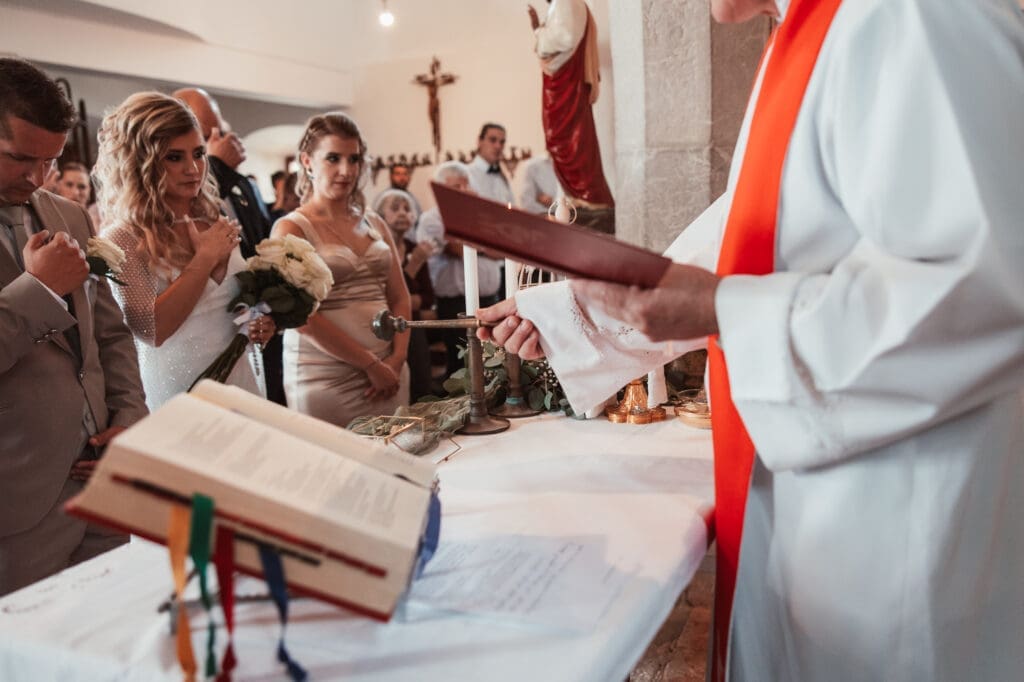 Zala and Matej during the church wedding ceremony at the Church of St. Michael in Šmihelj, Slovenia.
