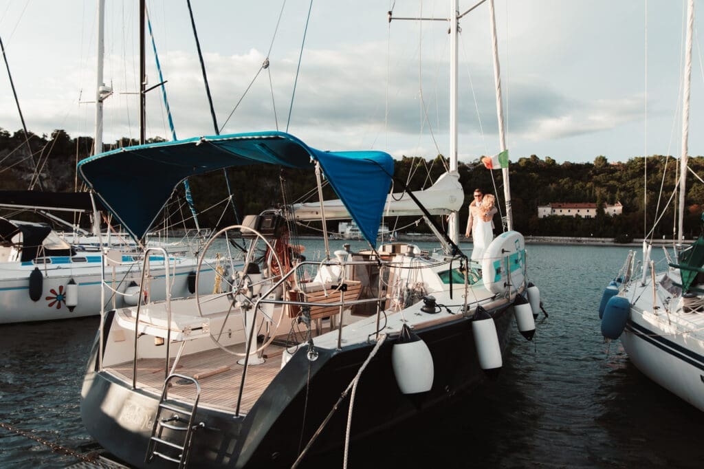 Matej's sailboat in Sistiana marina during Zala and Matej's wedding portrait session on the Adriatic coast.