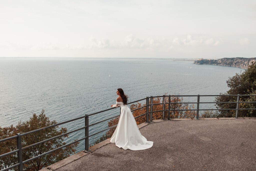 Bride overlooking the Adriatic coastline near Portopiccolo and Trieste, Italy