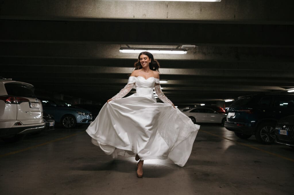 Bride running through the Silos parking garage during a modern editorial wedding photoshoot in Trieste, Italy