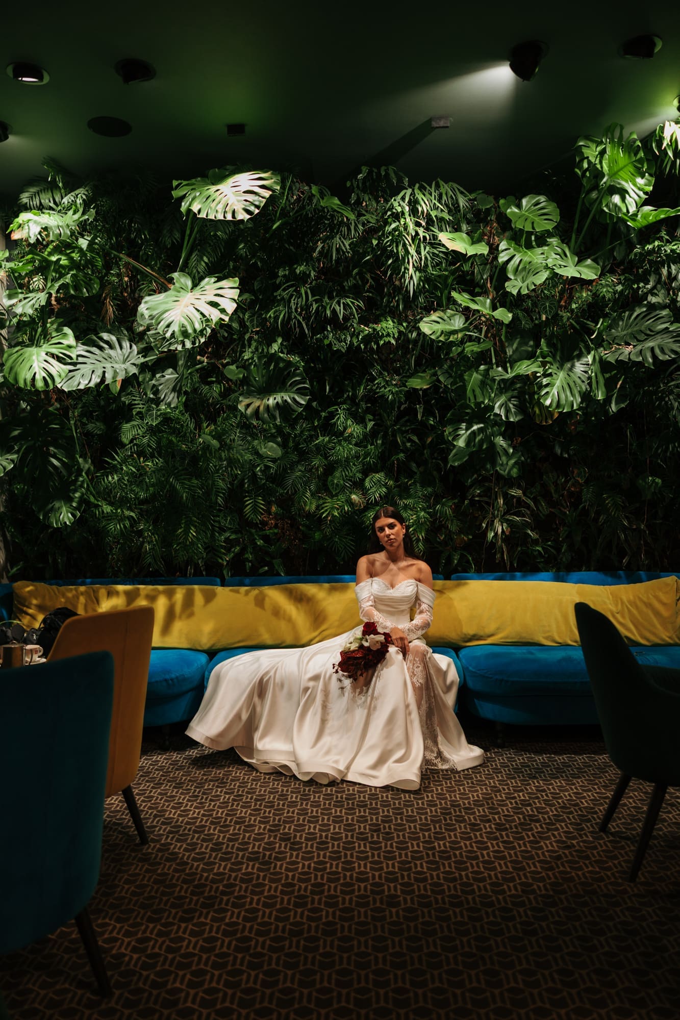 Bride seated at The Modernist Hotel on Corso Italia during an editorial wedding photoshoot in Trieste, Italy