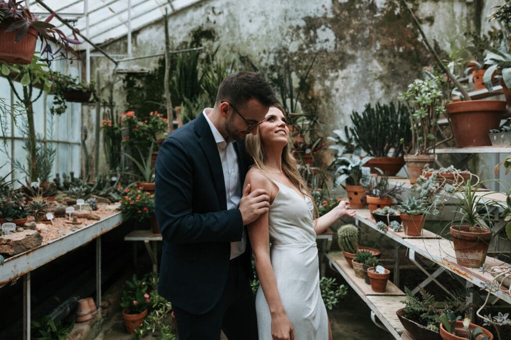 Bride and groom sharing a quiet moment inside the historic greenhouse at Villa Mirasasso wedding venue in Slovenia.