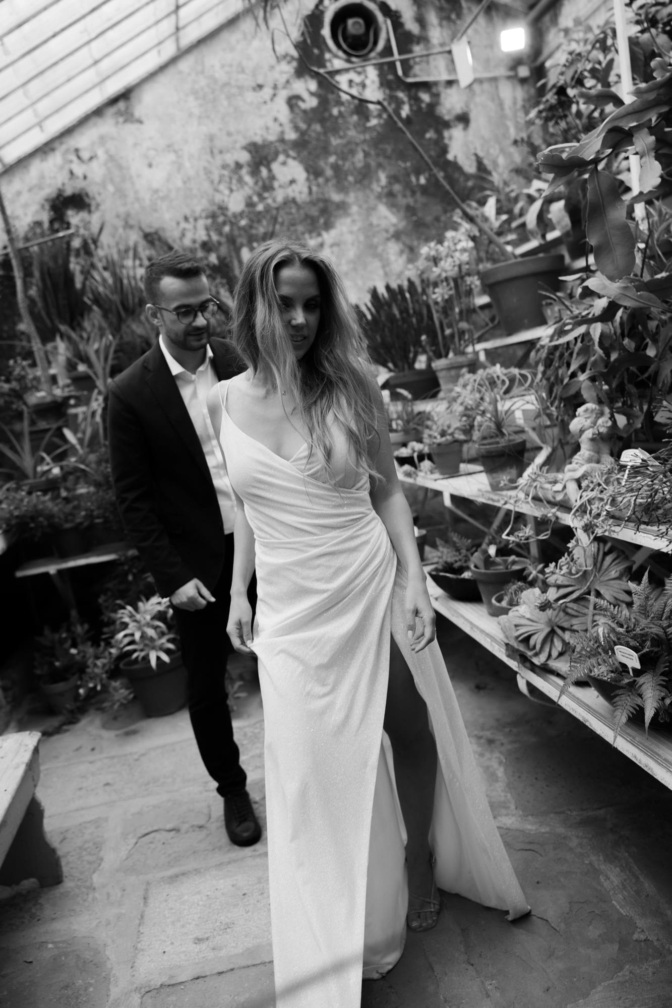 Bride leading her groom through the historic greenhouse at Villa Mirasasso near Sežana, Slovenia.